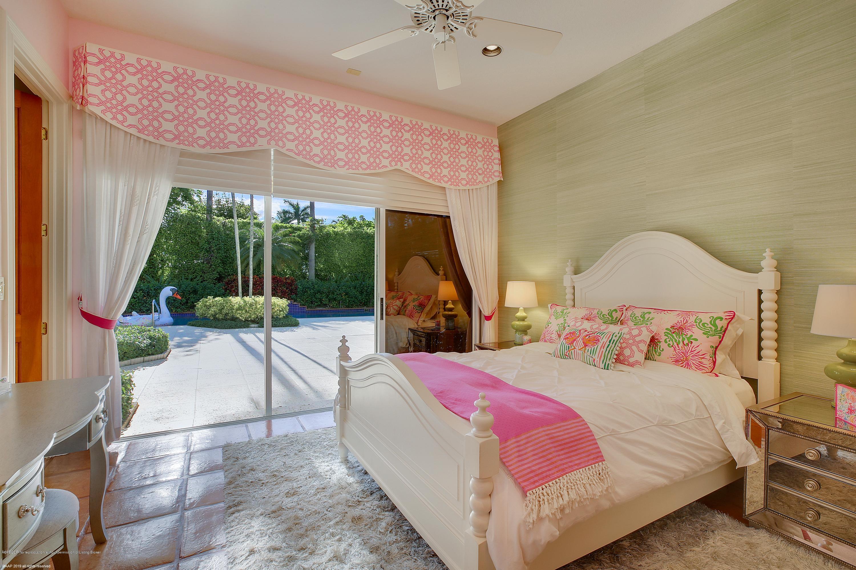 210 Wells Road Palm Beach, FL 33480 - Photo 30 of 65 a bedroom with a bed and a large window