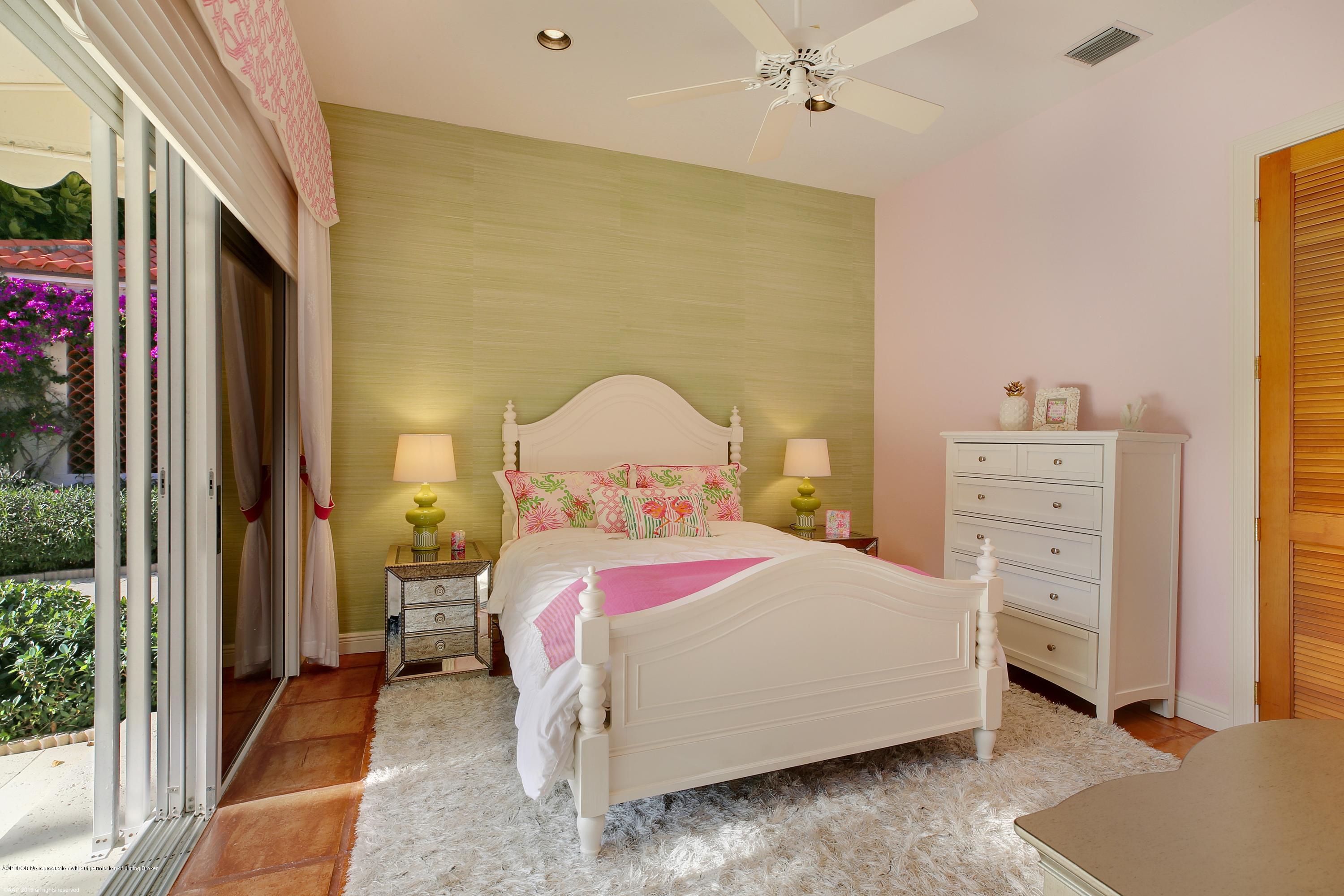 210 Wells Road Palm Beach, FL 33480 - Photo 31 of 65 a bedroom with a bed and a dresser