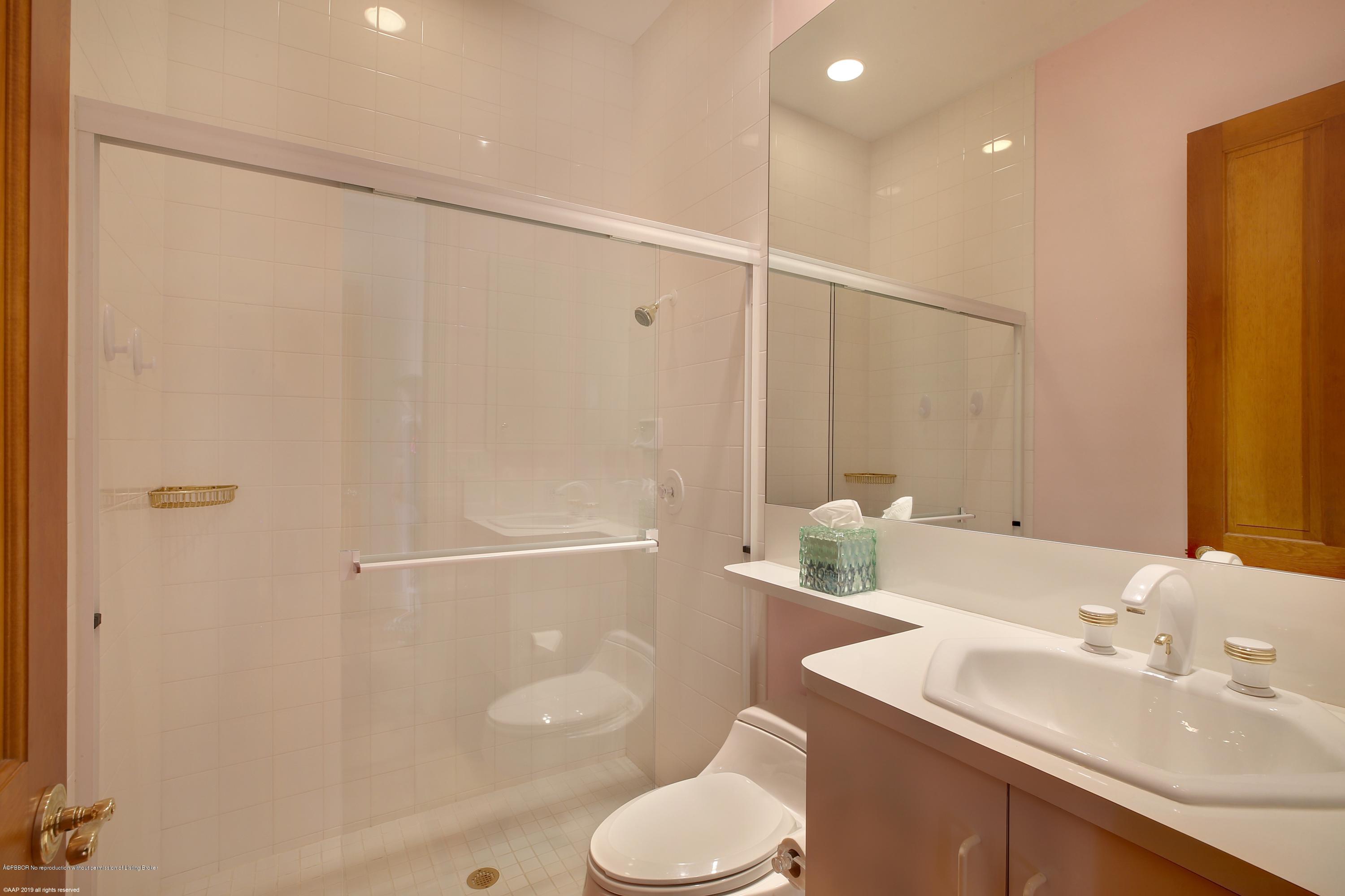 210 Wells Road Palm Beach, FL 33480 - Photo 33 of 65 a bathroom with a sink toilet and shower