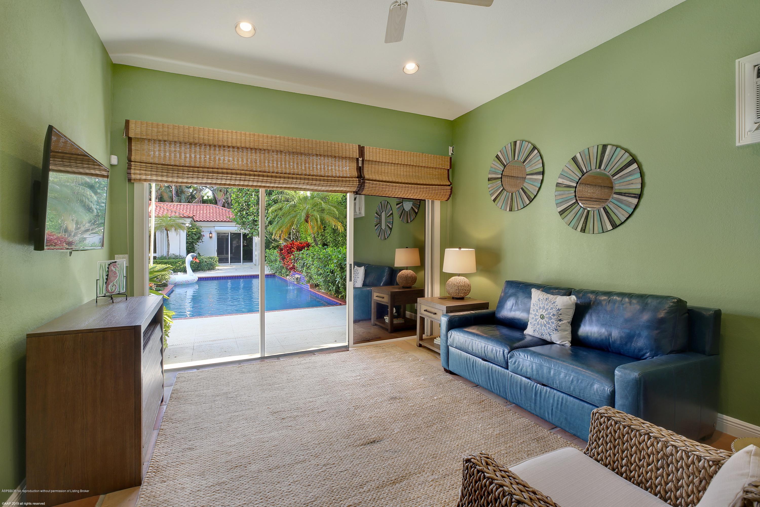 210 Wells Road Palm Beach, FL 33480 - Photo 34 of 65 a living room with furniture and a flat screen tv