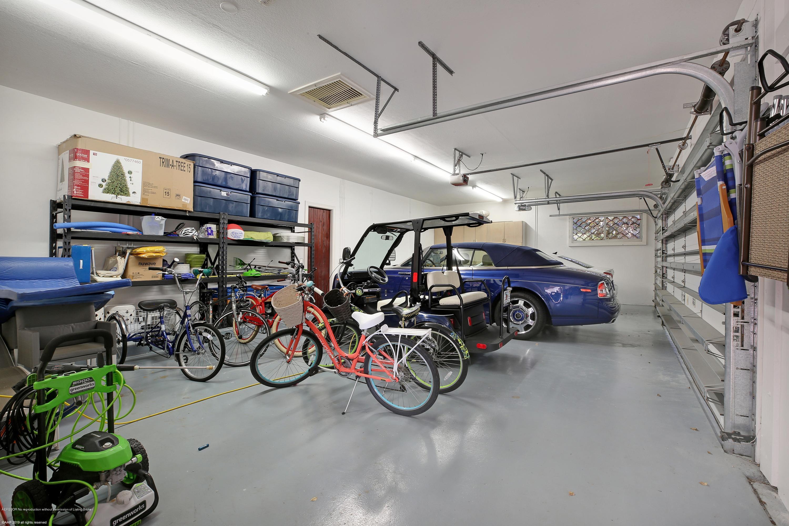 210 Wells Road Palm Beach, FL 33480 - Photo 36 of 65 a view of parking garage with cars