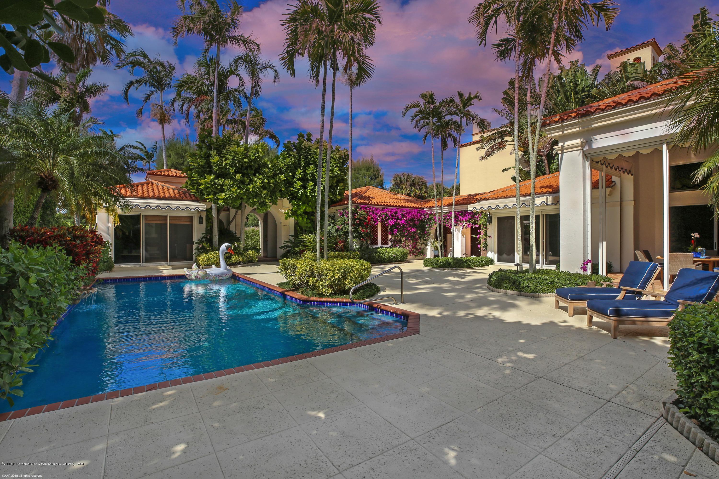 210 Wells Road Palm Beach, FL 33480 - Photo 7 of 65 a front view of a house with garden