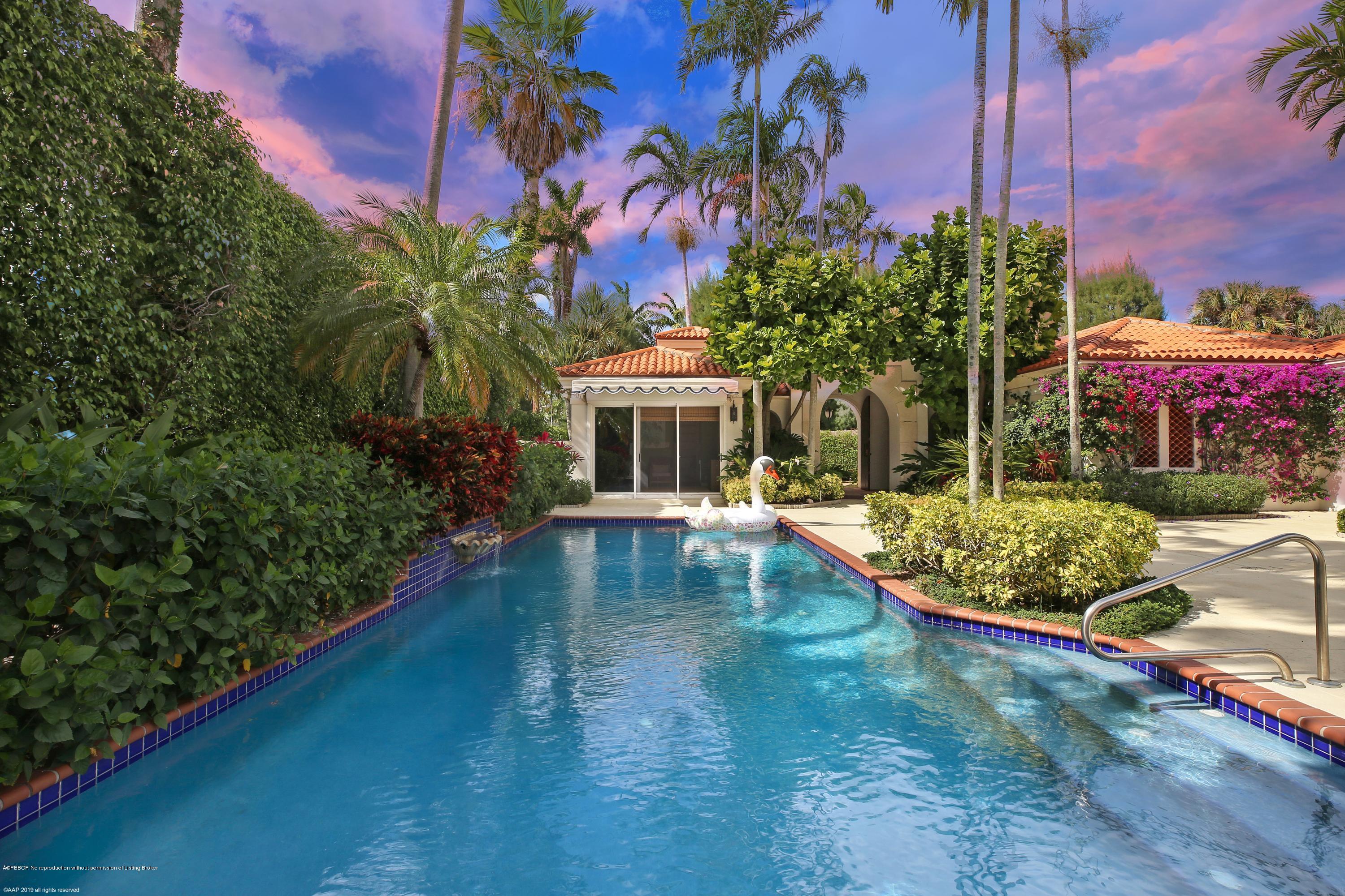 210 Wells Road Palm Beach, FL 33480 - Photo 8 of 65 a front view of a house with garden