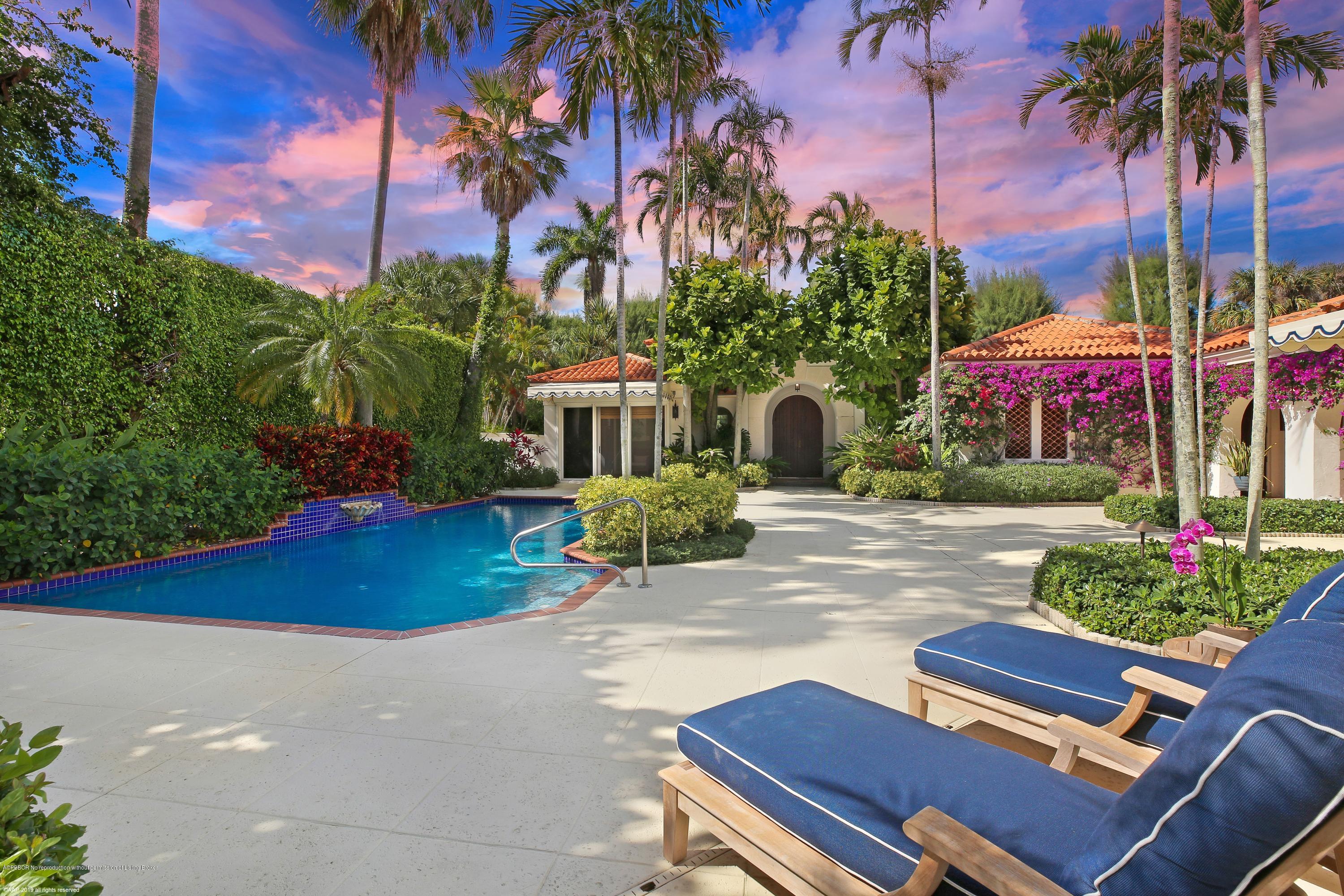 210 Wells Road Palm Beach, FL 33480 - Photo 9 of 65 a backyard of a house with lots of green space and fountain