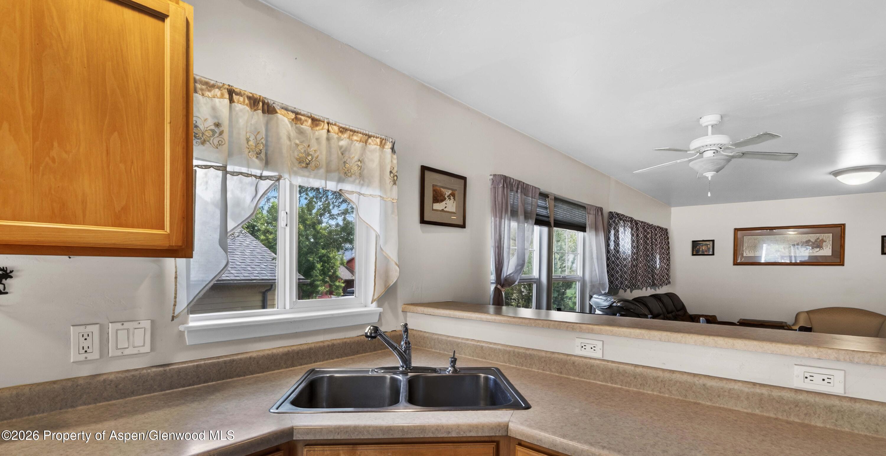 608 Lariat Loop New Castle, CO 81647 - Photo 9 of 32 a kitchen with a sink and a large window
