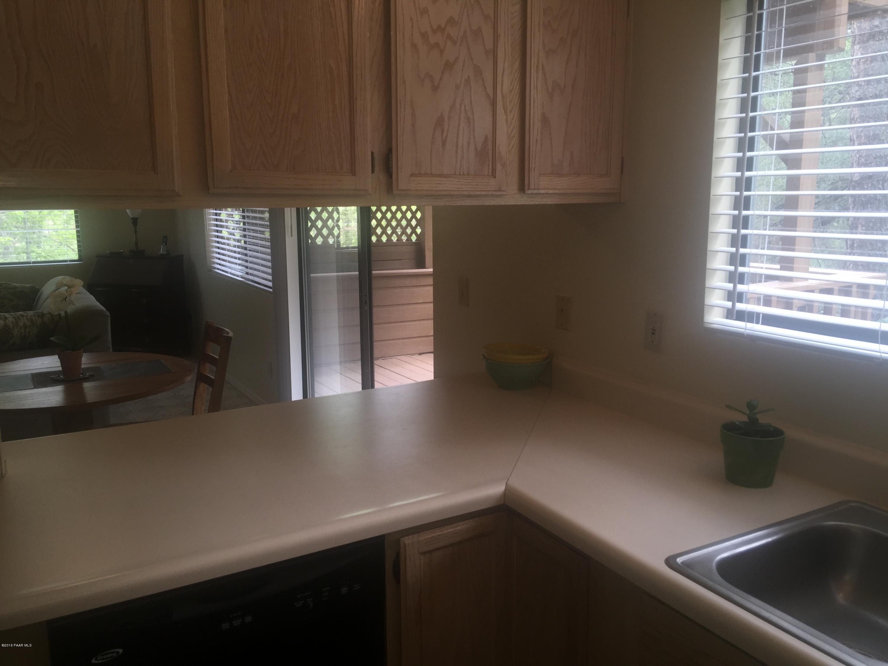 901 Old Stage Road, Unit 6D Prescott, AZ 86303 - Photo 21 of 33 Pass thru from Kitchen to Dining