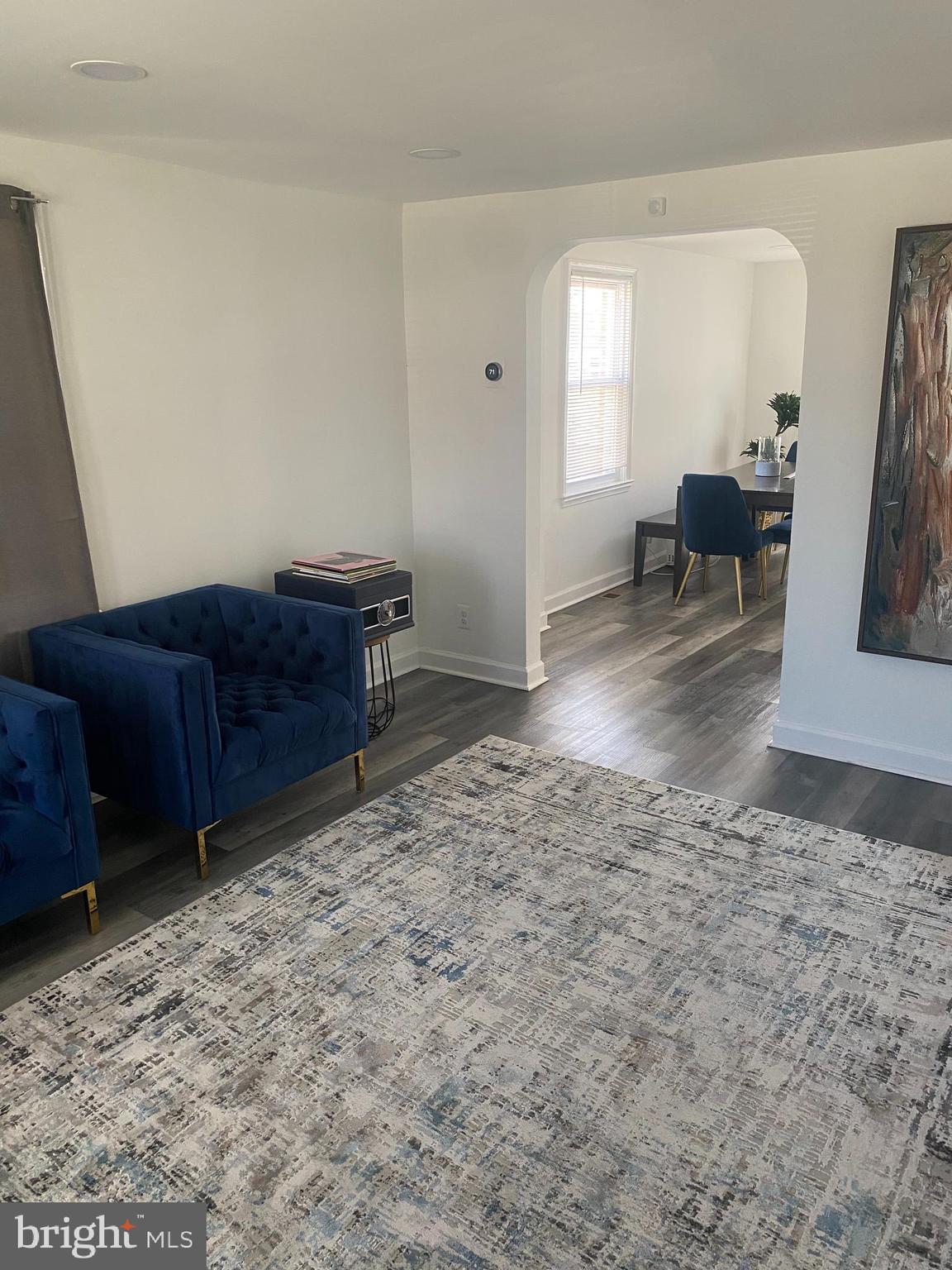 3643 Greenvale Road Baltimore, MD 21229 - Photo 18 of 23 a living room with furniture and a rug