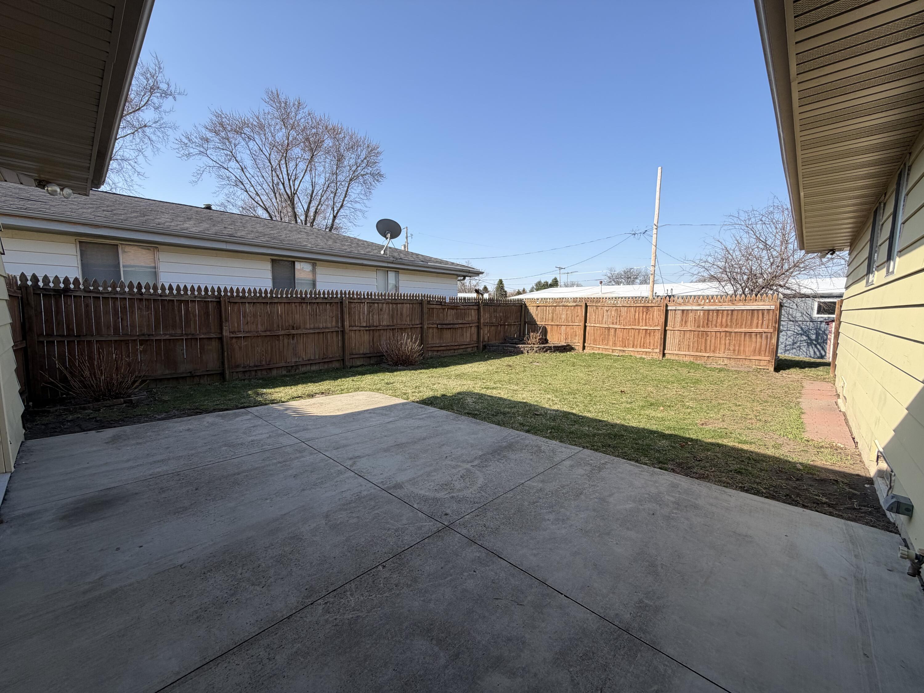 1624 State Street Union Grove, WI 53182 - Photo 13 of 16 Patio and fenced yard