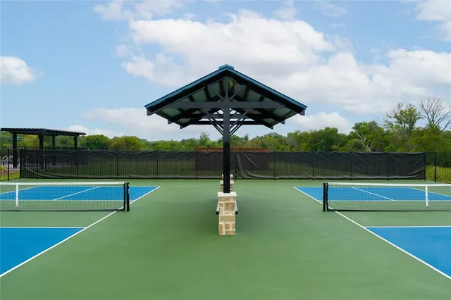 a view of a tennis court with a flat screen tv