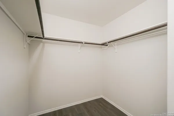 a view of an empty walk in closet