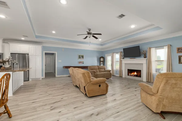 a living room with furniture and a fireplace