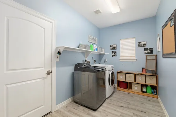 a kitchen with stainless steel appliances granite countertop a stove and a refrigerator