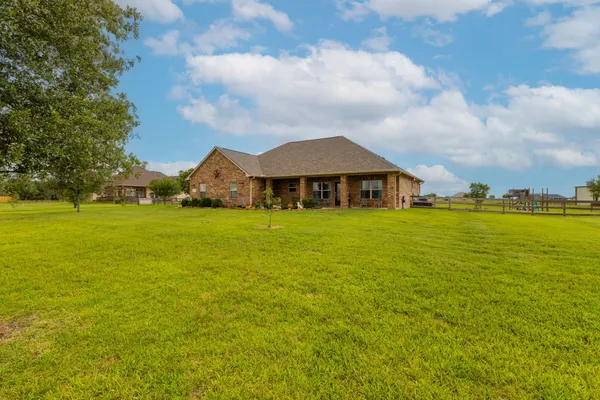 a view of a house with a garden