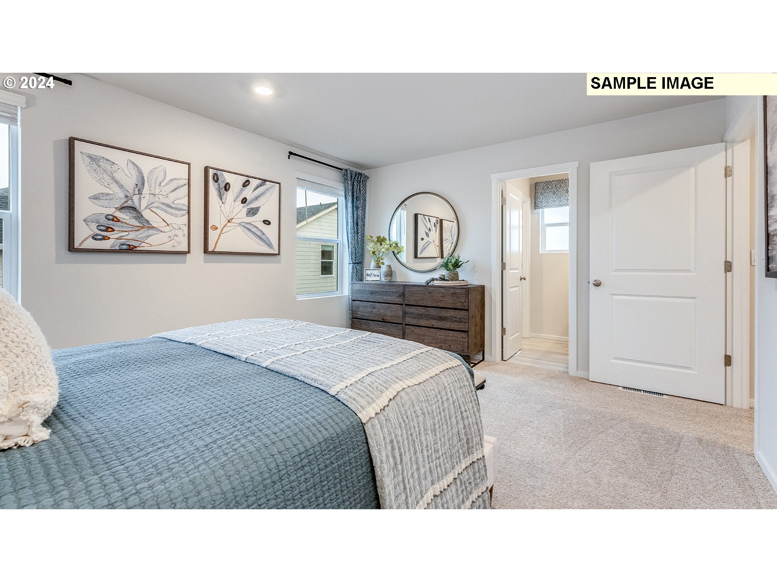 833 Northeast 174th Street Ridgefield, WA 98642 - Photo 24 of 28 a bedroom with a bed and a painting on the wall