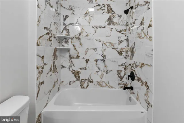 a bathroom with a sink and a bathtub