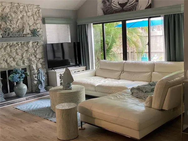 a living room with furniture and a large window