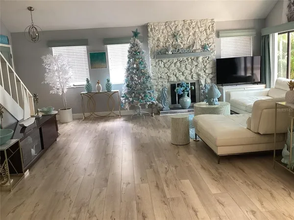 a view of a dining room with furniture and wooden floor