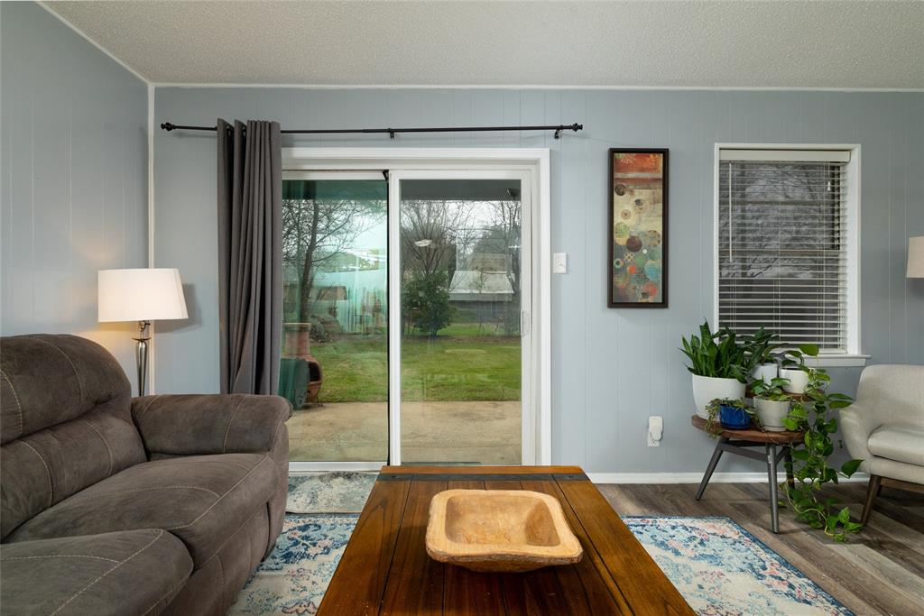 6020 Harrison Way Watauga, TX 76148 - Photo 11 of 32 a living room with furniture and a window