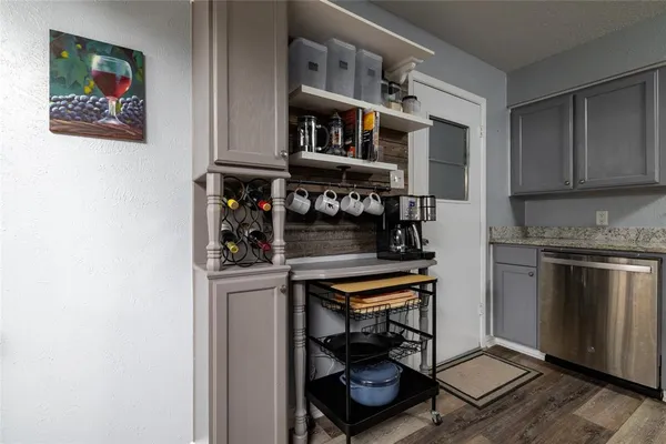 a kitchen with stainless steel appliances granite countertop a stove and a refrigerator