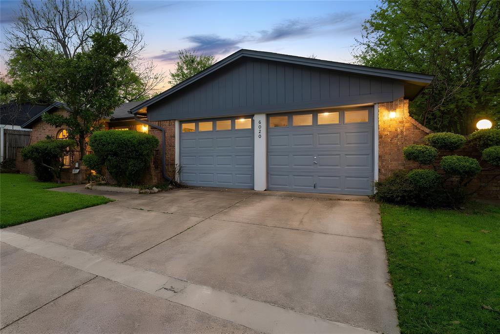 6020 Harrison Way Watauga, TX 76148 - Photo 2 of 32 a front view of a house with a yard
