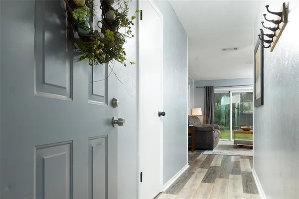 a bedroom with a bed and a mirror