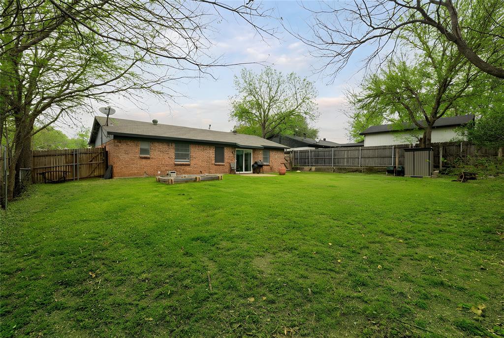 6020 Harrison Way Watauga, TX 76148 - Photo 30 of 32 a view of a house with a yard porch and sitting area