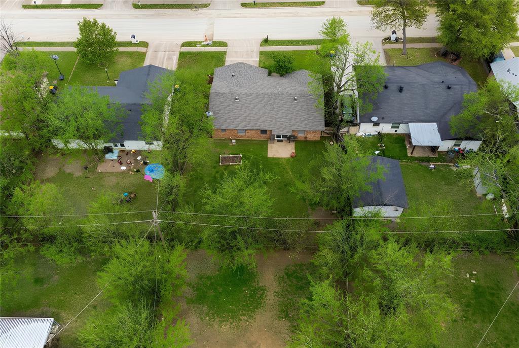 6020 Harrison Way Watauga, TX 76148 - Photo 31 of 32 an aerial view of residential house with outdoor space and trees all around