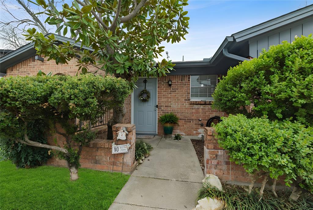 6020 Harrison Way Watauga, TX 76148 - Photo 4 of 32 a front view of a house with garden
