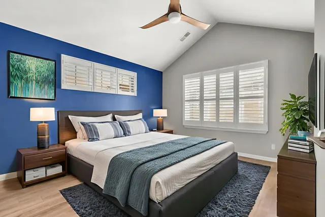 a bedroom with bed and a window