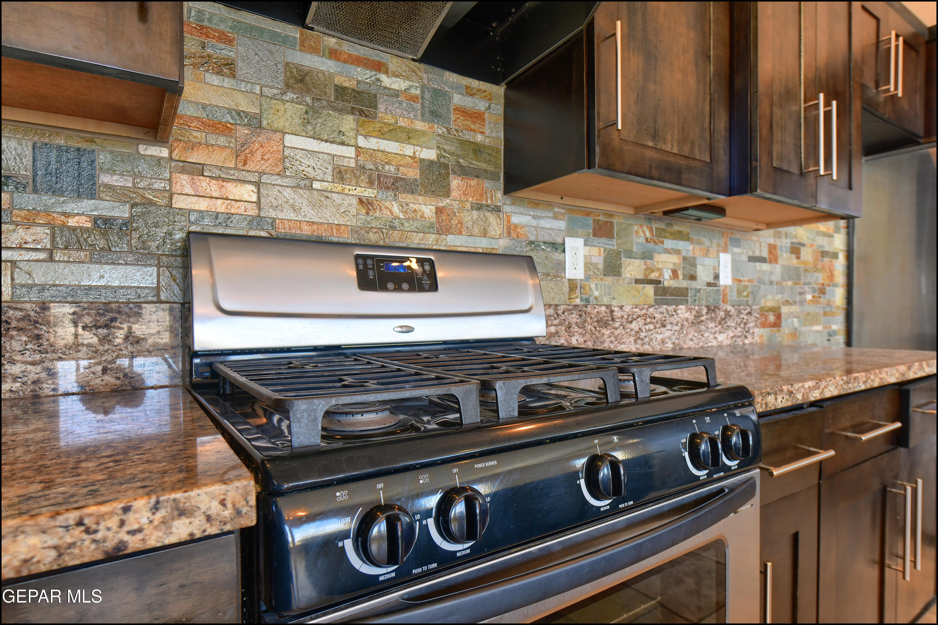 401 Ana Way, Unit B El Paso, TX 79912 - Photo 15 of 54 a stove top oven sitting inside of a kitchen