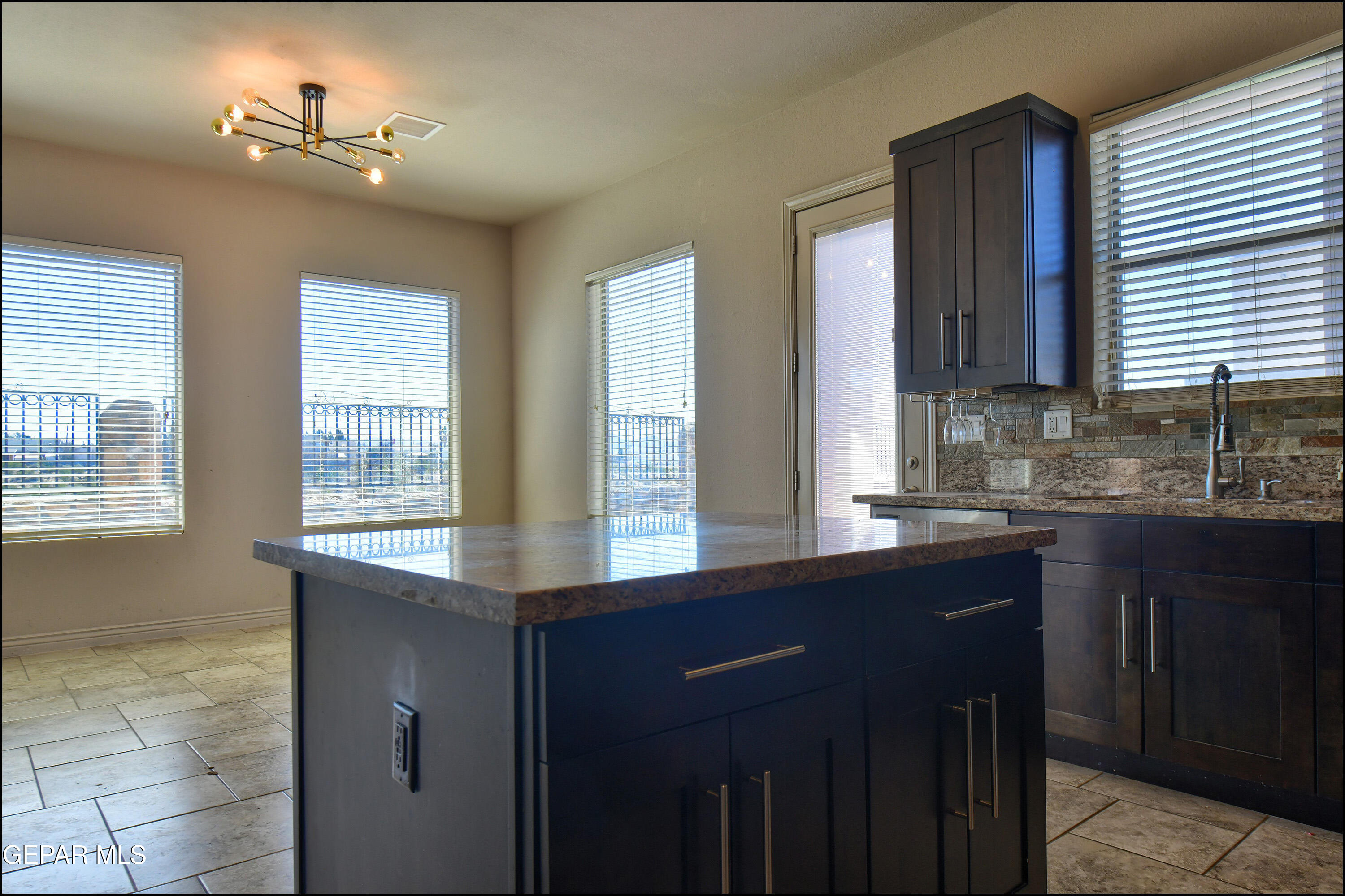 401 Ana Way, Unit B El Paso, TX 79912 - Photo 17 of 54 a kitchen with a sink and a window