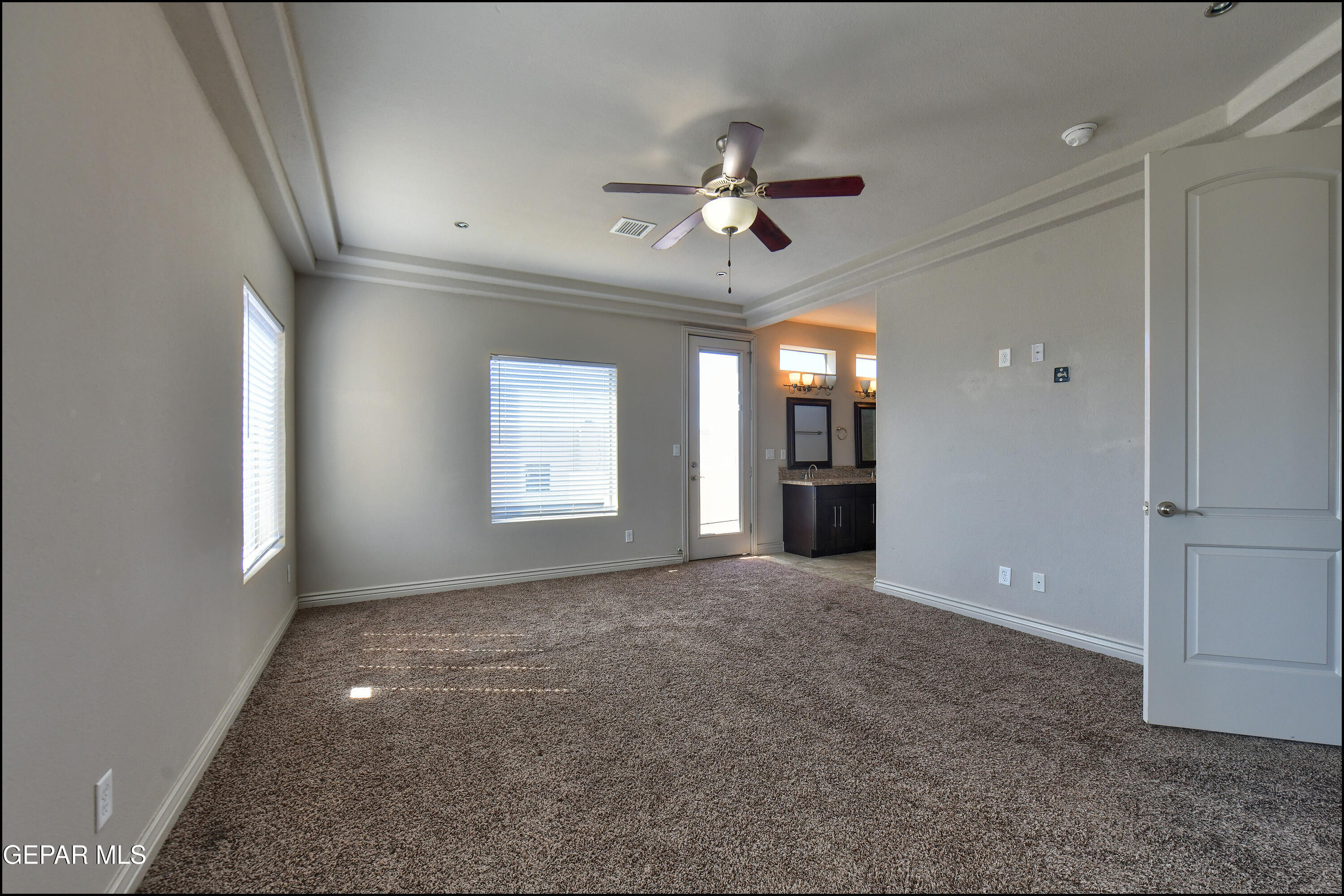 401 Ana Way, Unit B El Paso, TX 79912 - Photo 22 of 54 a view of a livingroom with a ceiling fan and window