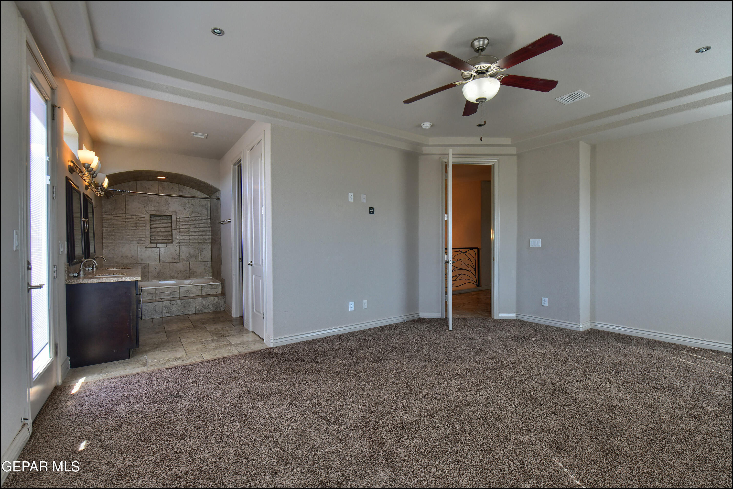401 Ana Way, Unit B El Paso, TX 79912 - Photo 23 of 54 a view of a livingroom with a ceiling fan and window