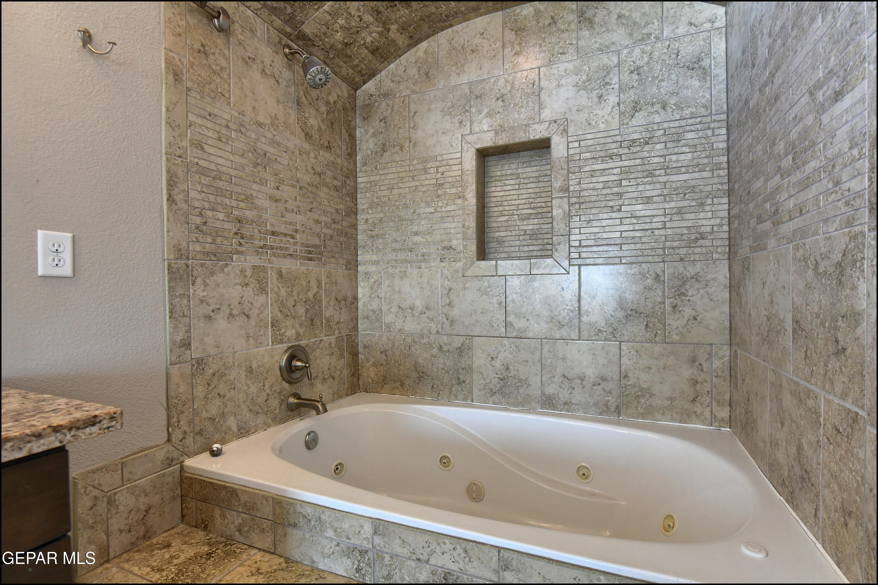 401 Ana Way, Unit B El Paso, TX 79912 - Photo 26 of 54 a bathroom with a tub and shower