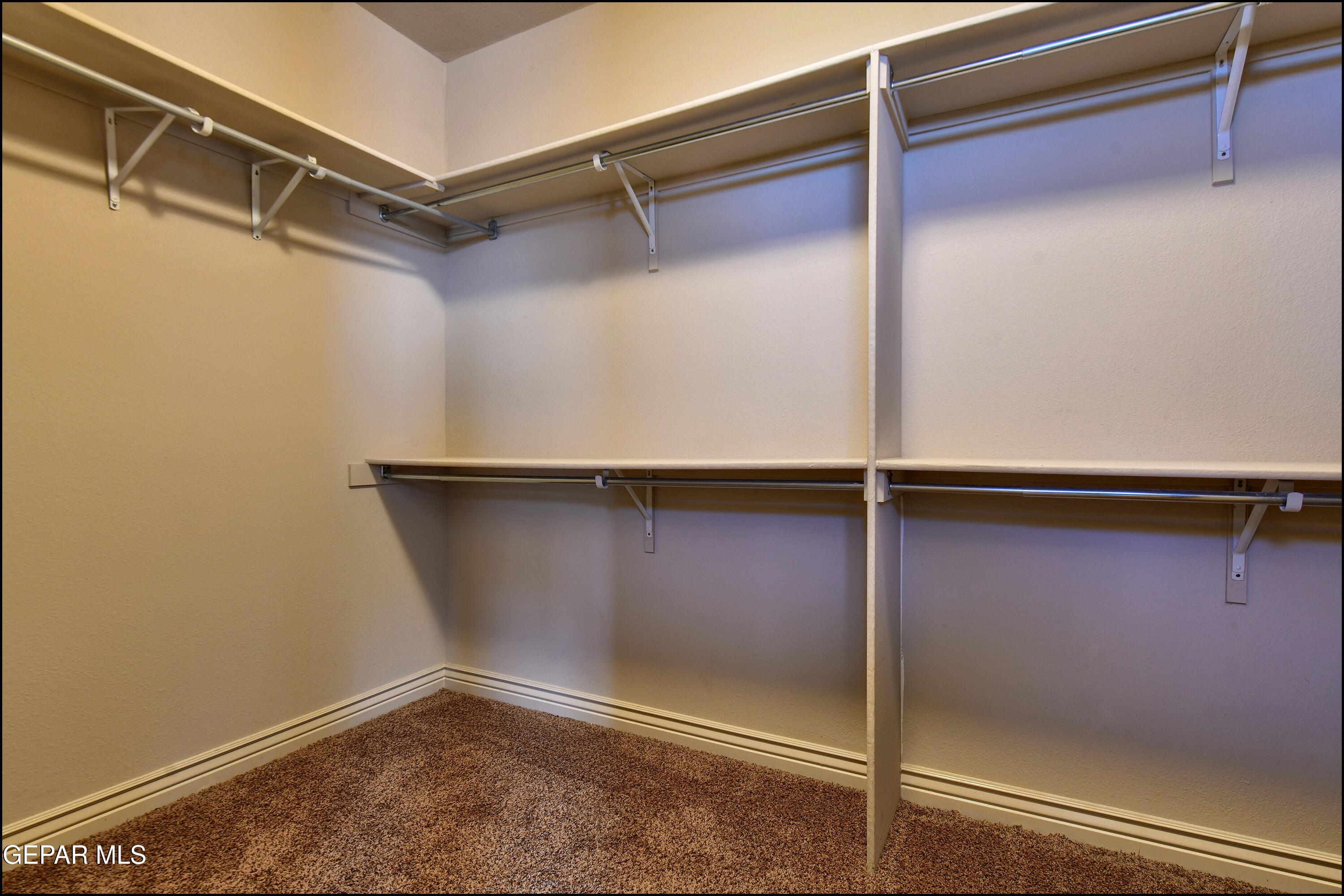 401 Ana Way, Unit B El Paso, TX 79912 - Photo 27 of 54 a view of a room with racks on the wall