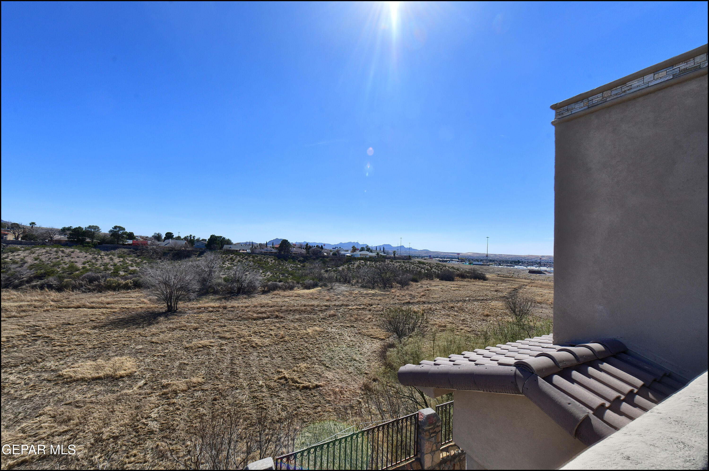 401 Ana Way, Unit B El Paso, TX 79912 - Photo 41 of 54 a view of a terrace with wooden floor and a lake view