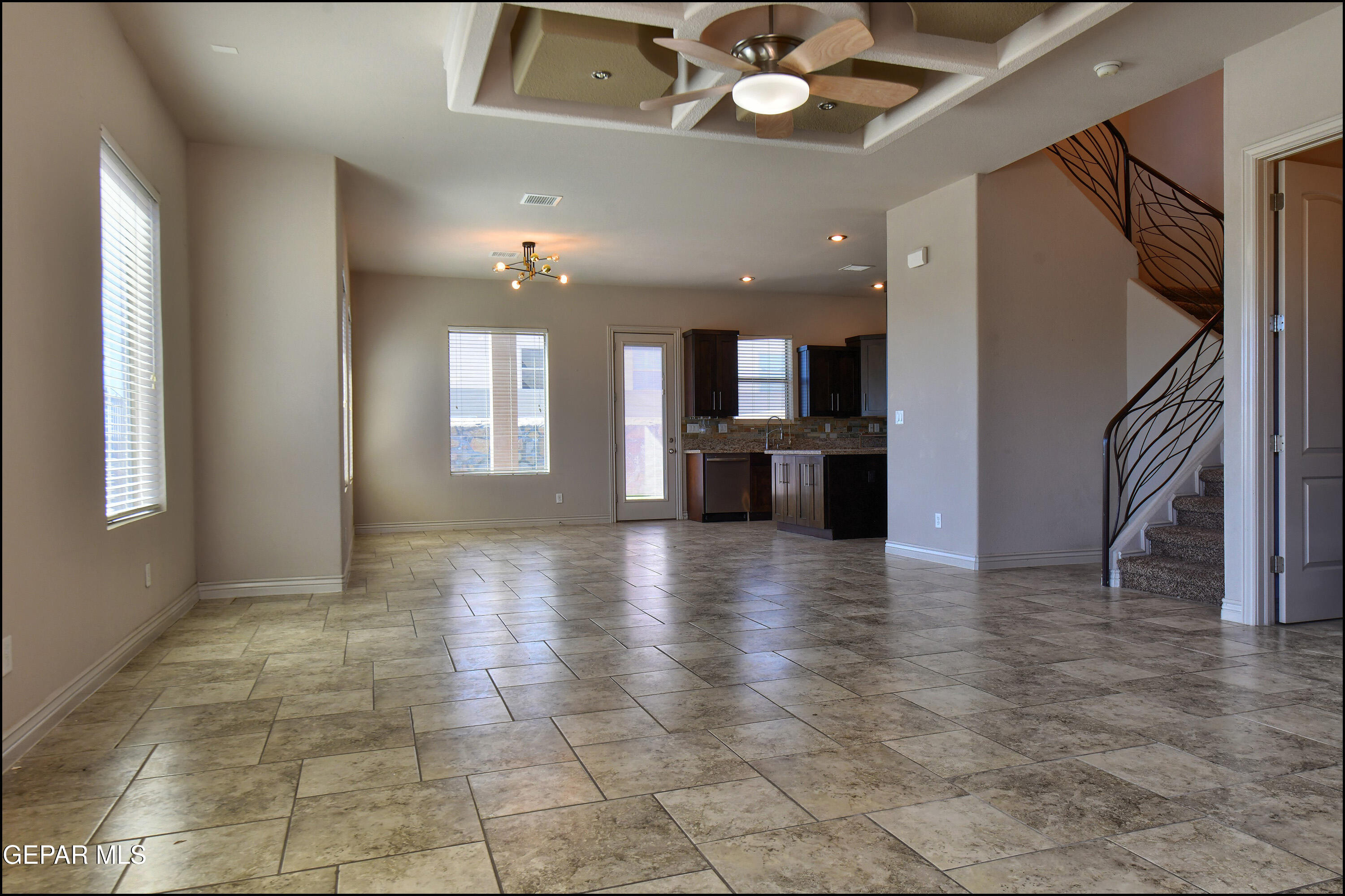 401 Ana Way, Unit B El Paso, TX 79912 - Photo 5 of 54 a view of a kitchen with a sink and a large window