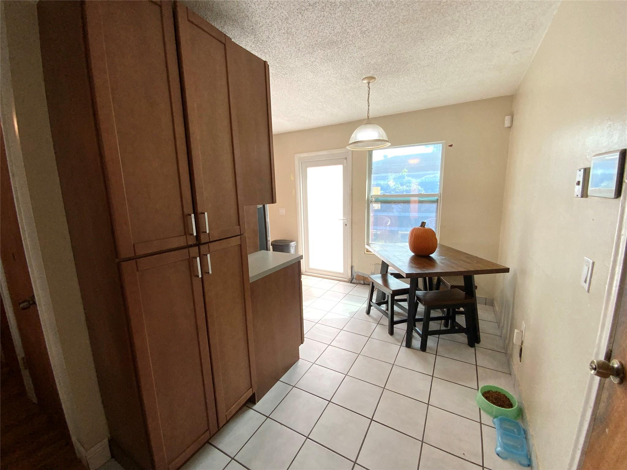 8160 Southwest 6th Street North Lauderdale, FL 33068 - Photo 11 of 39 a view of a dining room with furniture and chandelier