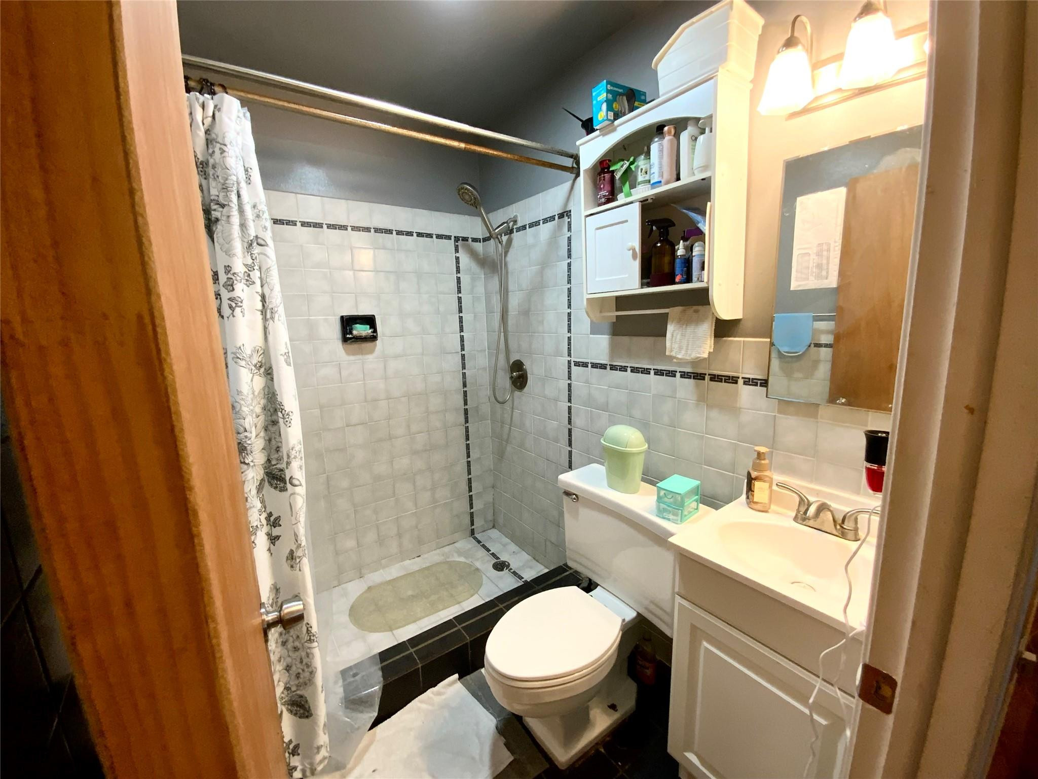 8160 Southwest 6th Street North Lauderdale, FL 33068 - Photo 25 of 39 a bathroom with a sink toilet a mirror and shower