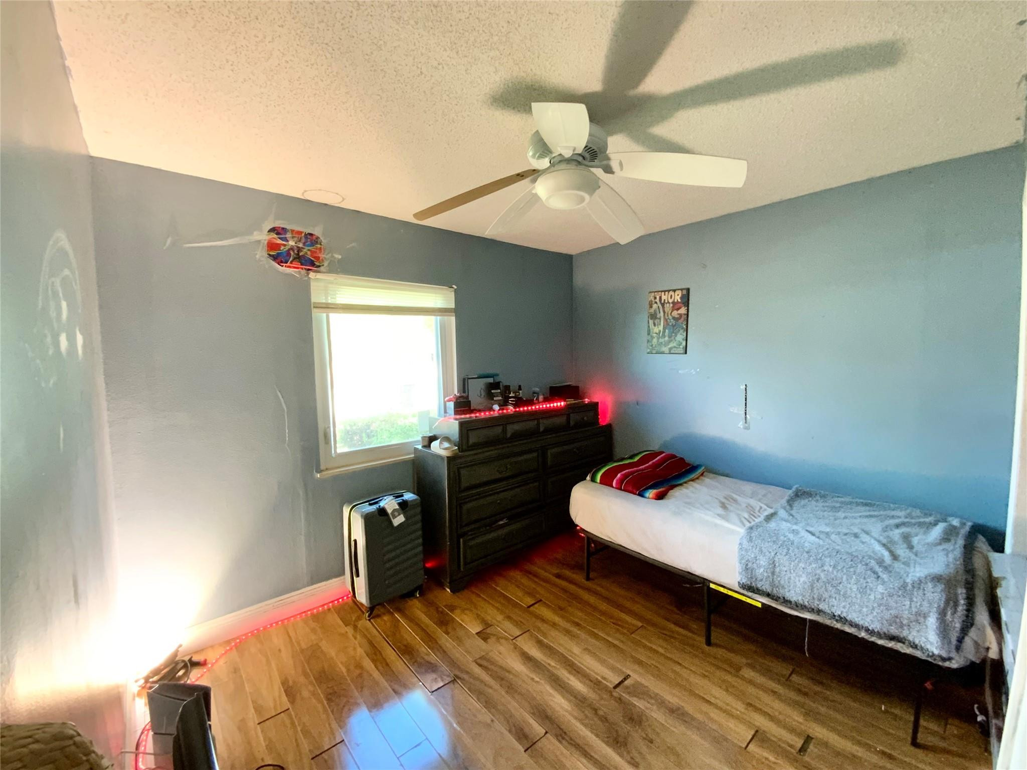 8160 Southwest 6th Street North Lauderdale, FL 33068 - Photo 28 of 39 a bedroom with a bed and a chandelier