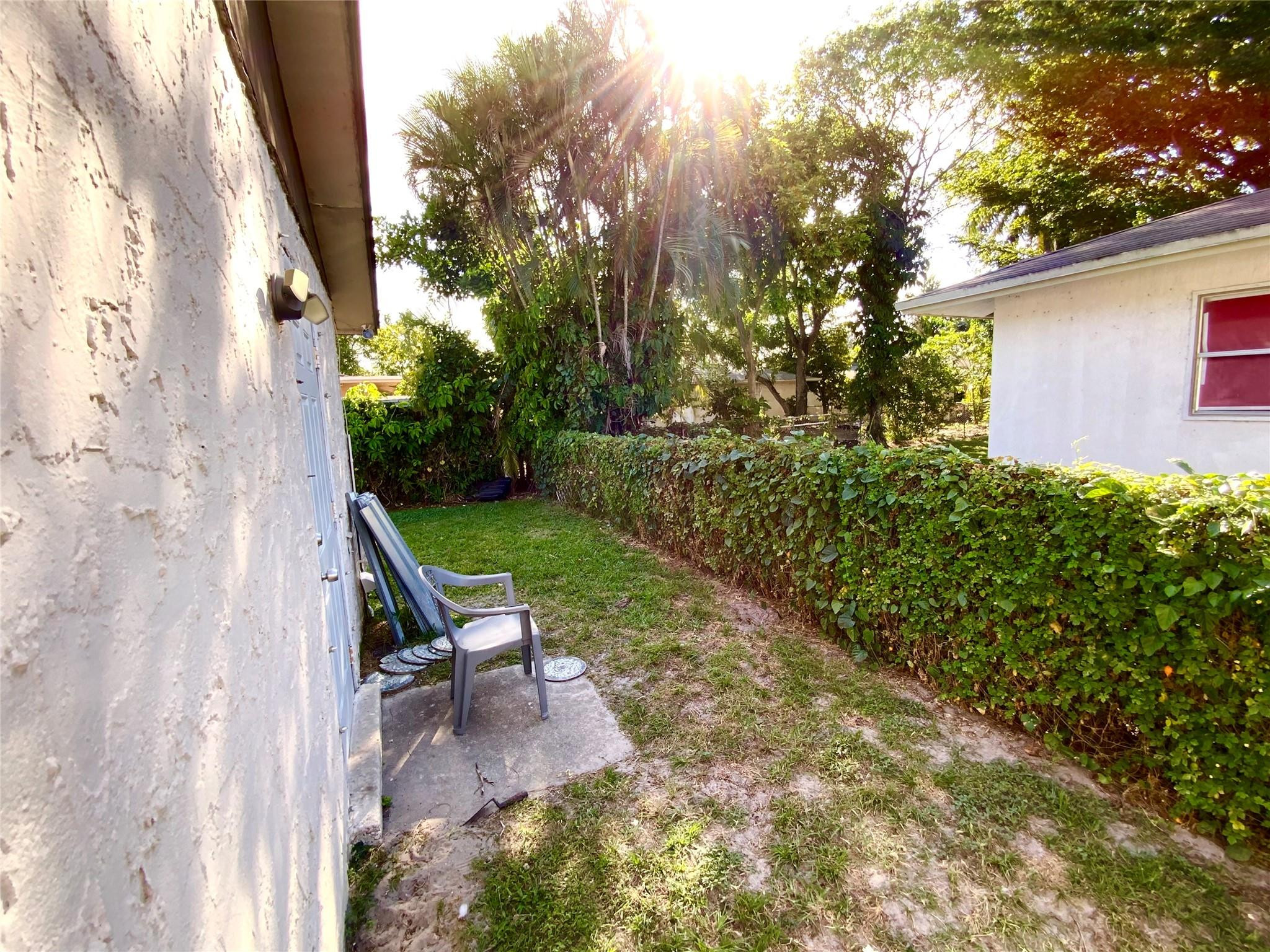 8160 Southwest 6th Street North Lauderdale, FL 33068 - Photo 34 of 39 a view of a wooden bench in backyard of a house