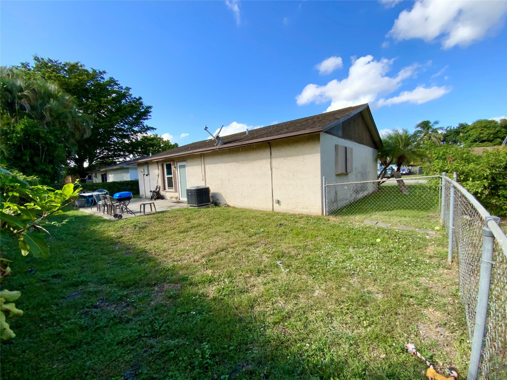 8160 Southwest 6th Street North Lauderdale, FL 33068 - Photo 38 of 39 a front view of house with yard and green space