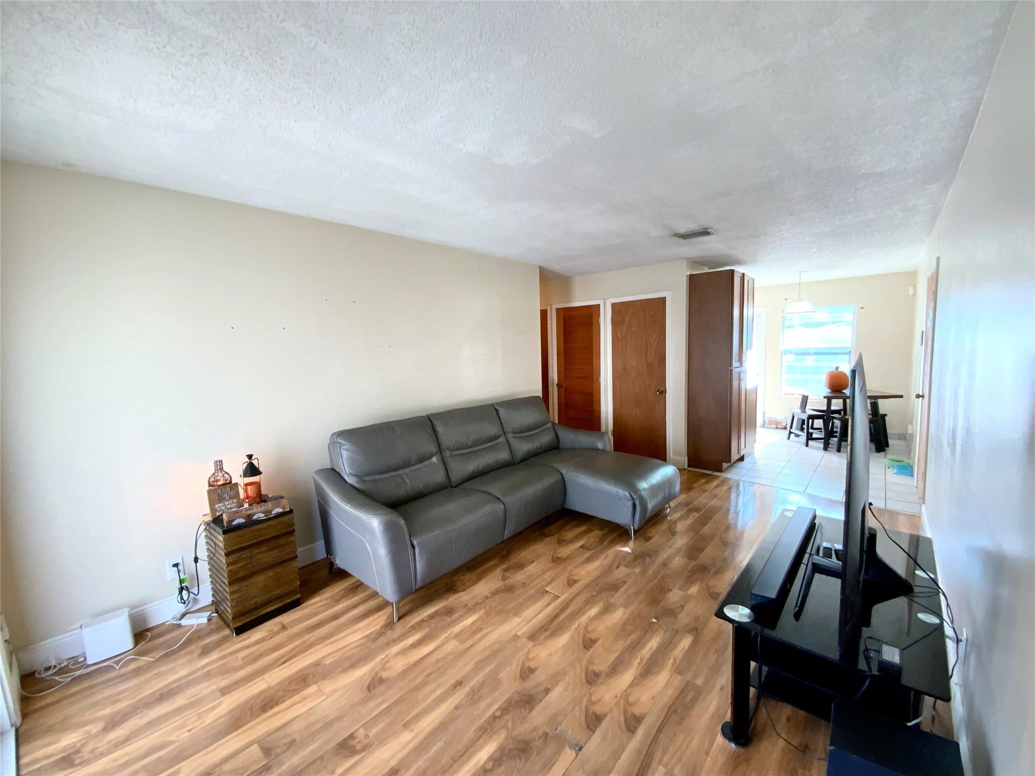 8160 Southwest 6th Street North Lauderdale, FL 33068 - Photo 7 of 39 a living room with furniture and a wooden floor