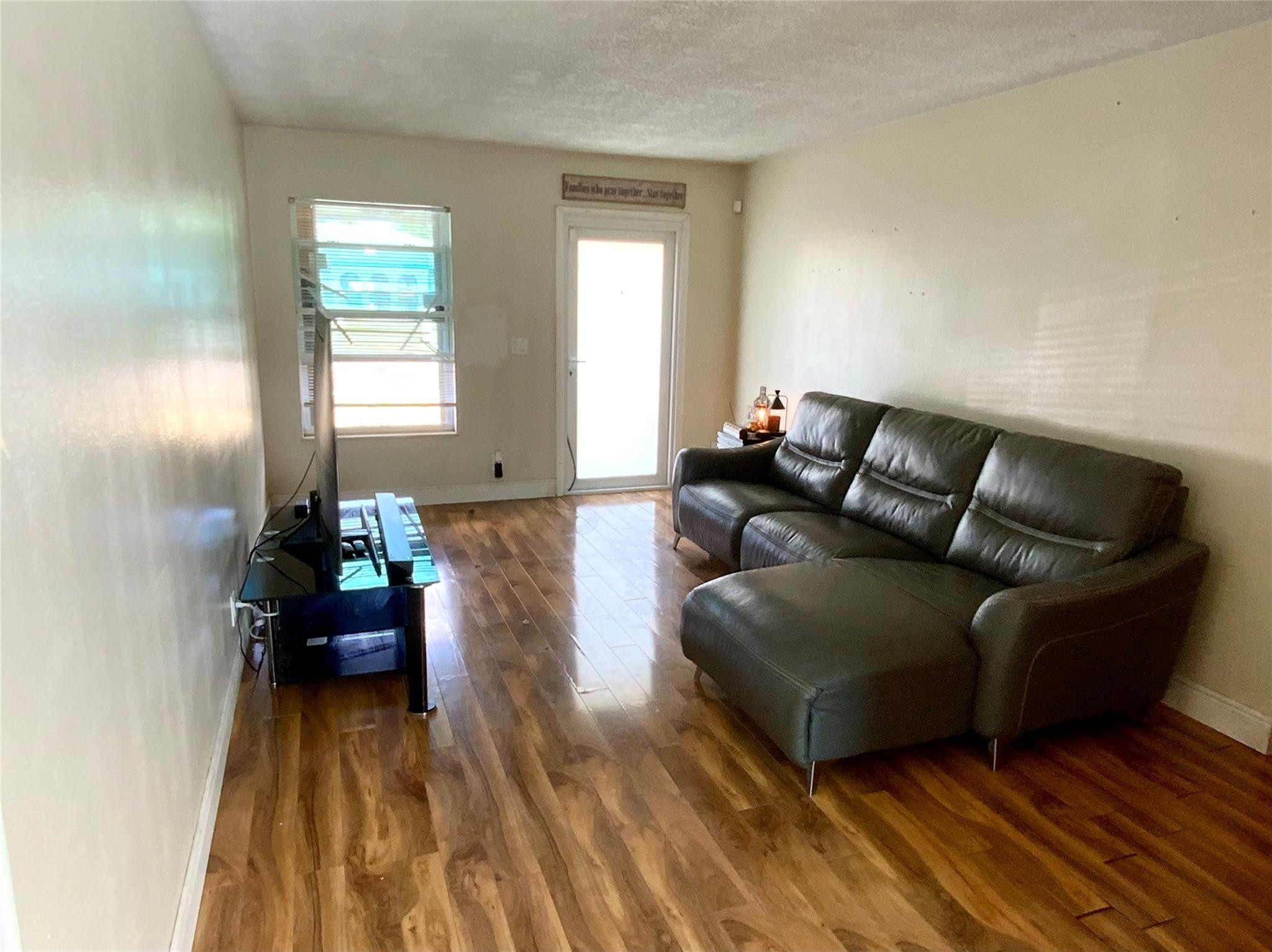 8160 Southwest 6th Street North Lauderdale, FL 33068 - Photo 8 of 39 a living room with furniture and a wooden floor