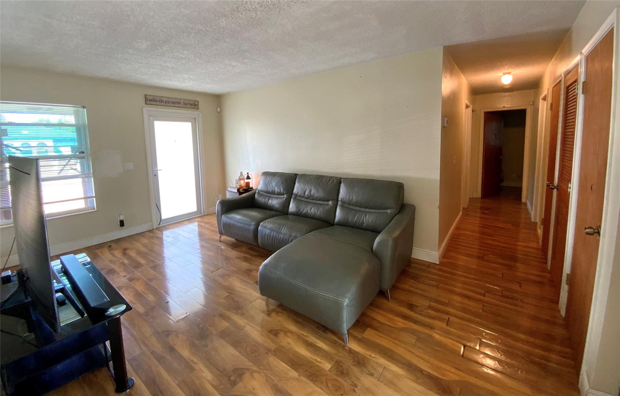 8160 Southwest 6th Street North Lauderdale, FL 33068 - Photo 10 of 39 a living room with furniture and a wooden floor