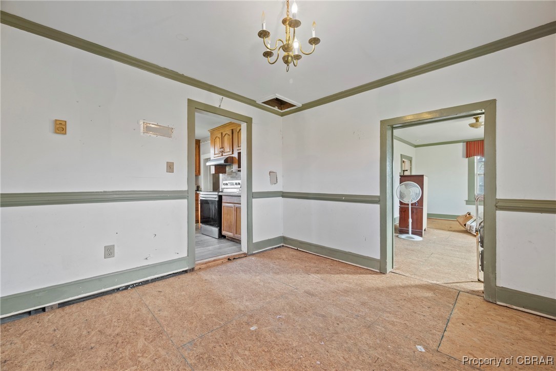 1282 Water View Road Water View, VA 23180 - Photo 10 of 49 Unfurnished room with crown molding and a chandelier