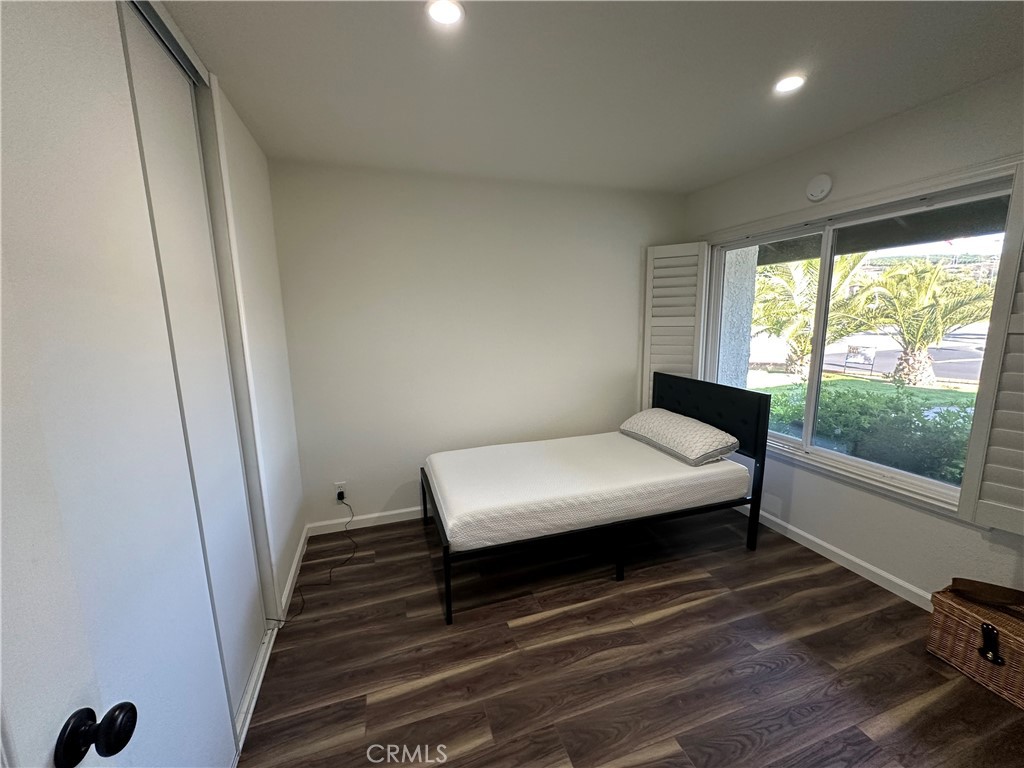 13191 Honeybee Street Moorpark, CA 93021 - Photo 15 of 27 a bedroom with a bed and a window