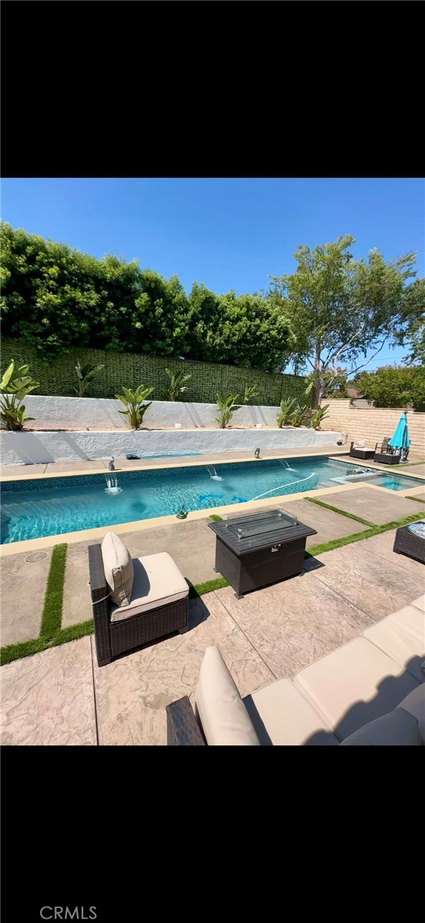 13191 Honeybee Street Moorpark, CA 93021 - Photo 5 of 27 a view of swimming pool with seating area and green space