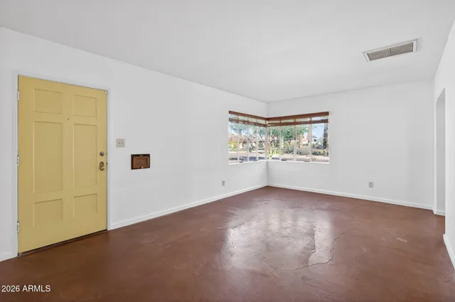 an empty room with windows