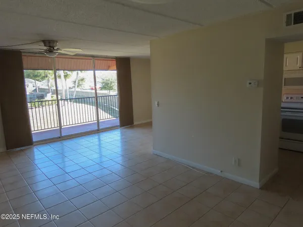 a view of a hallway with a room